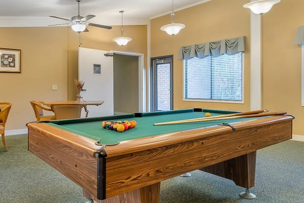 A pool table in an activity room