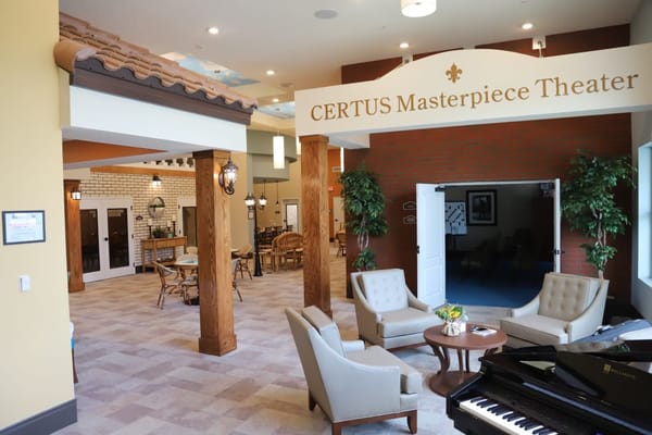 Cozy lobby area featuring seating and décor at CERTUS Masterpiece Theater.