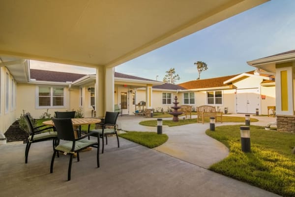 Patio area with seating and nearby building