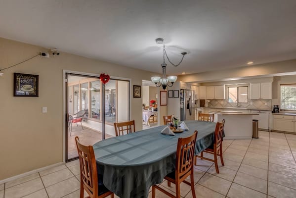 Bright common area with a table and chairs