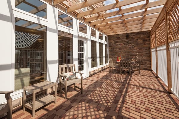 Outdoor patio area with seating and lattice work