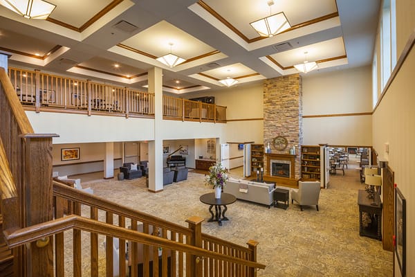 Interior view of a common area with seating and fireplace