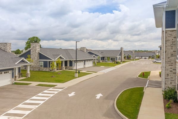 Aerial view of a senior living community with homes and landscaping