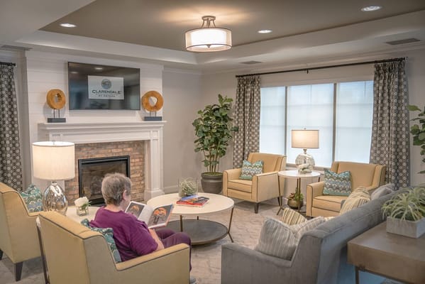 Resident reading in a cozy common area