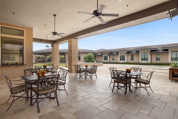 Outdoor patio area with seating at Clayton Oaks Living
