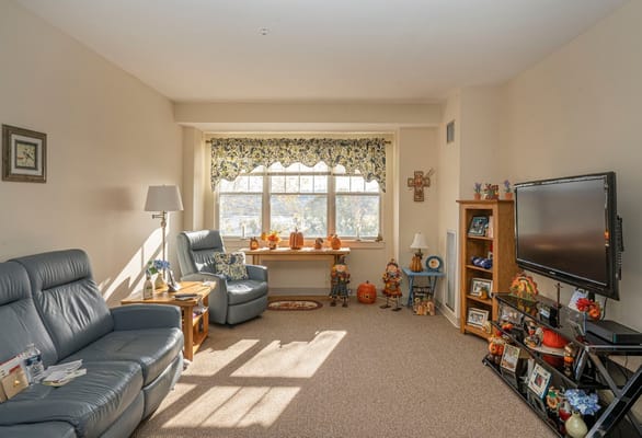 Cozy living room with seasonal decorations and natural light