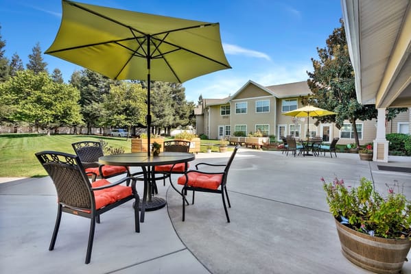 Outdoor seating area with umbrellas at Dale Commons