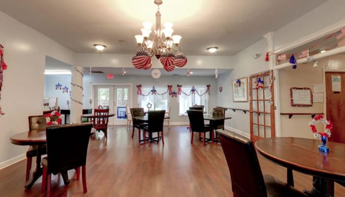 Spacious common area decorated with patriotic themes and furniture