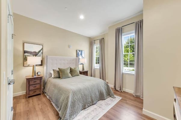 Cozy bedroom with a bed and large window