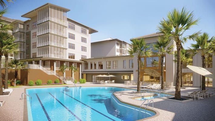 Exterior view of a senior living facility with a pool and palm trees