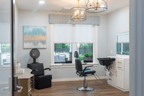 Hair salon area with styling chairs and natural light