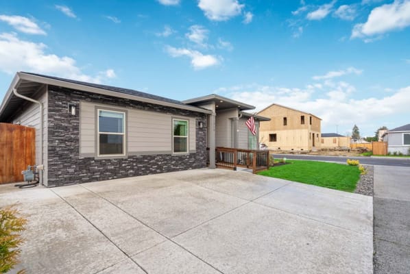 Exterior view of a residential building with an American flag