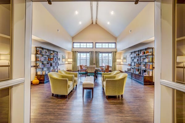 Bright common area with seating and bookshelves