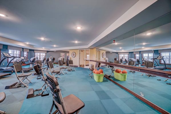 Well-equipped fitness room with exercise machines