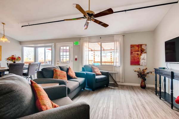 Bright common area with comfortable seating and decor