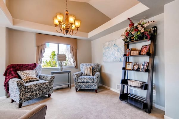 Bright and welcoming common area with chairs and decor