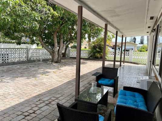Outdoor patio with seating and trees