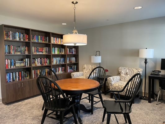 Cozy reading nook with bookshelves and seating