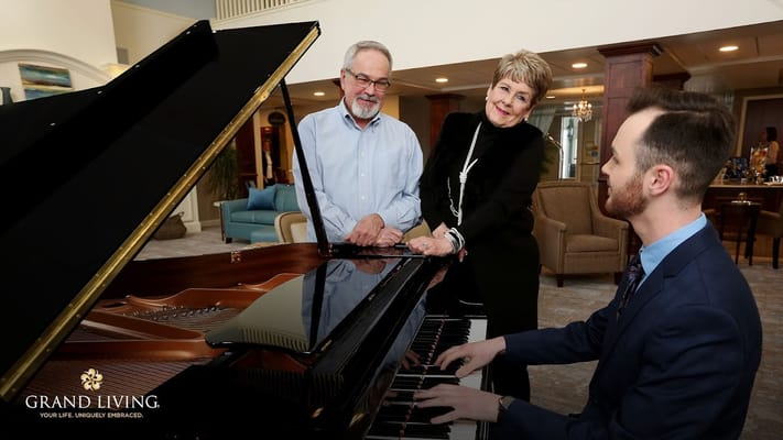 Residents and staff enjoying music together in a community area