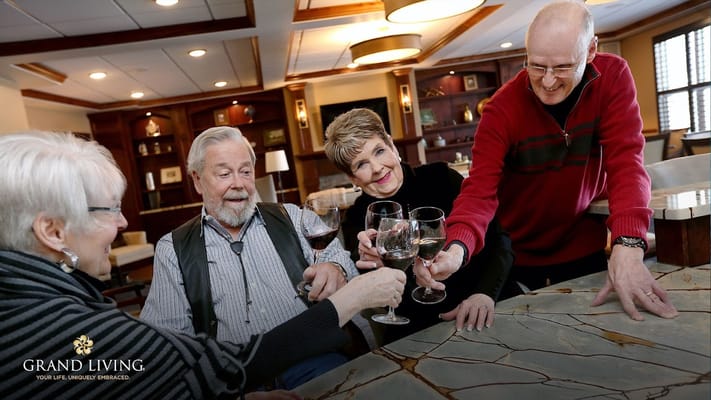 Residents and staff toasting in a common area