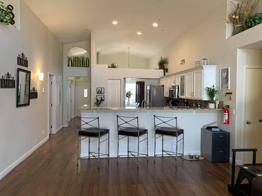 Bright, open communal kitchen area with seating