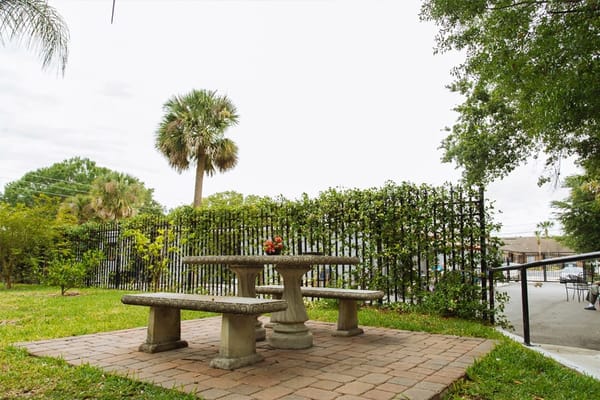 Outdoor seating area with a table and benches