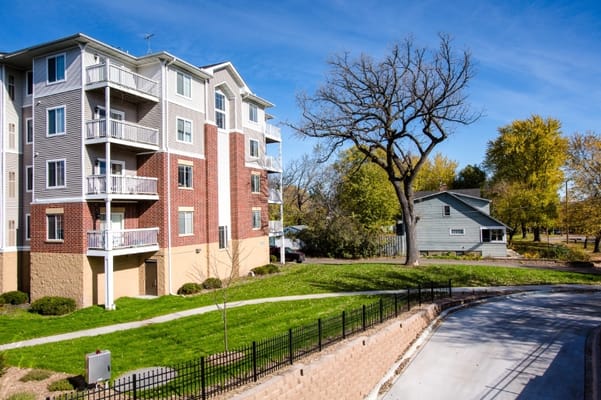 Exterior view of the Highland Path building with greenery