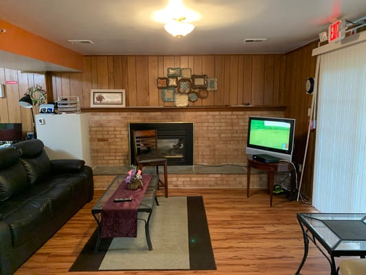 Cozy common area with seating and fireplace