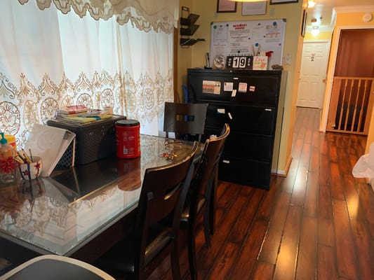 Dining area with wooden furniture and colorful decor