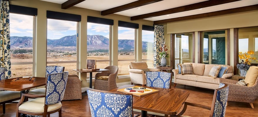 Interior common area with large windows and seating