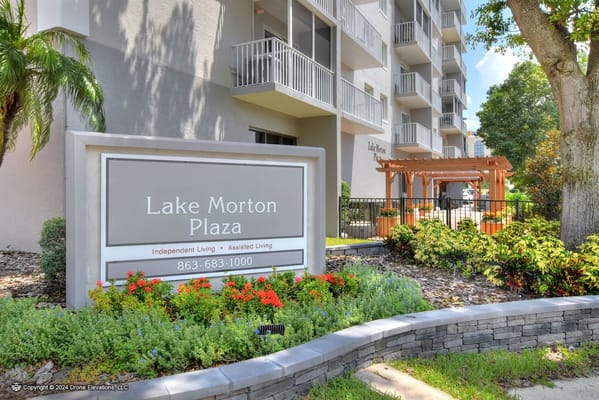 Entrance sign of Lake Morton Plaza showing independent and assisted living services.