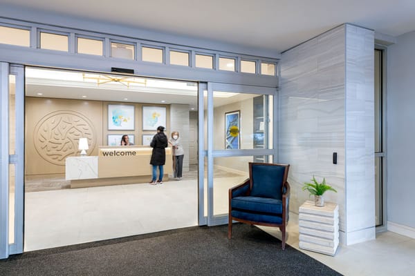 Welcoming reception area with staff and guests