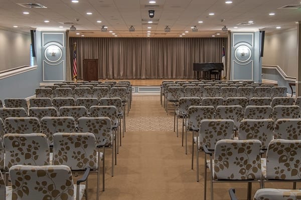Spacious auditorium with chairs and a stage