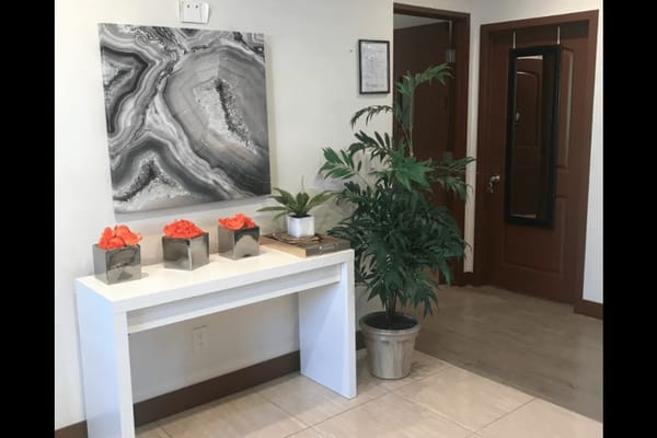 Bright, welcoming interior entryway with decor and plants