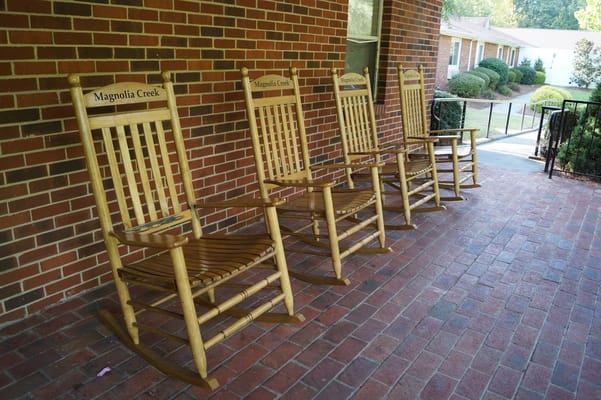 Rocking chairs on a porch at Magnolia Creek