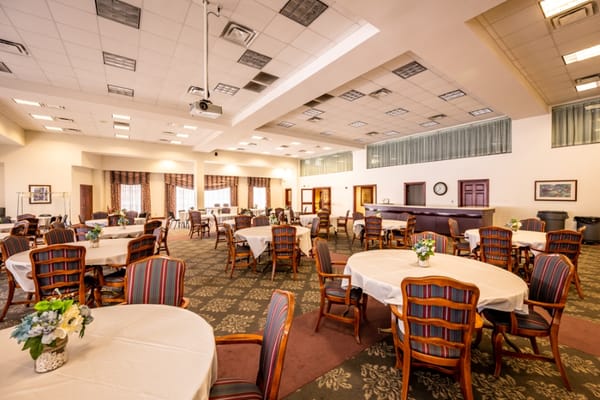 Bright common area with tables and chairs