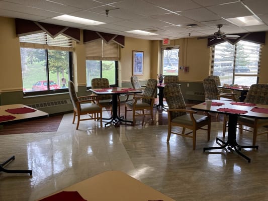 Bright dining area with tables and chairs