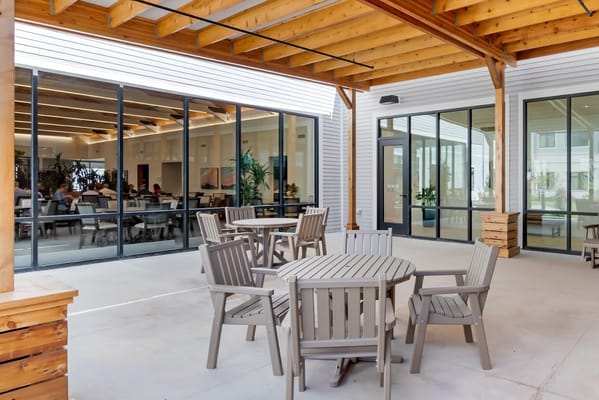 Outdoor seating area with tables and chairs