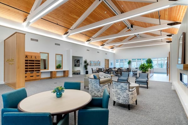 Spacious lounge area with seating and natural light at Meadowbrook Senior Living.