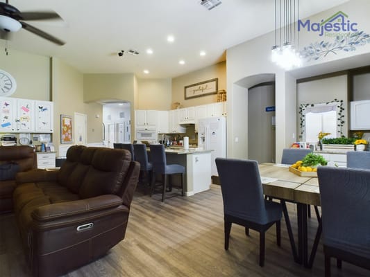 Bright common area with seating and dining table