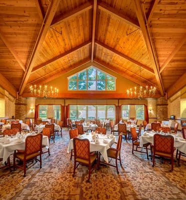 Elegant dining room with tables set for meal service