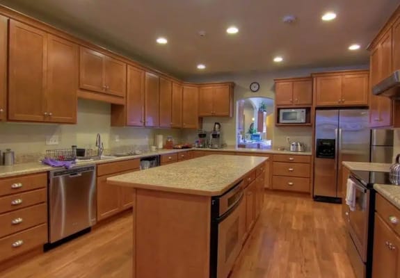 Modern kitchen with wooden cabinets and granite countertops