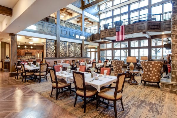 Elegant dining room with tables set for a meal