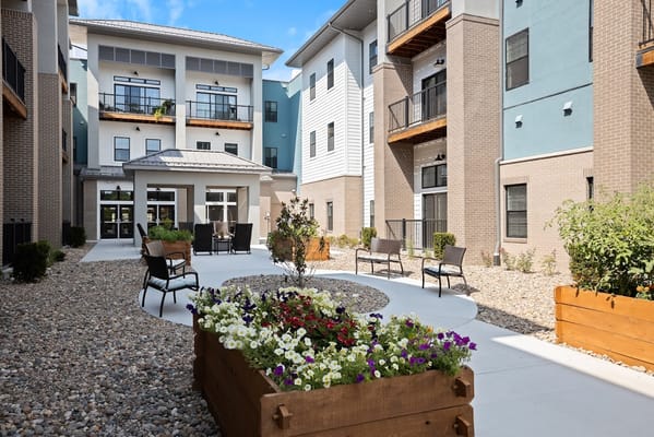 Outdoor courtyard with flowers and seating