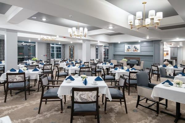 Bright dining room setup with tables and chairs