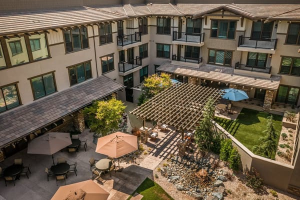 Aerial view of a landscaped courtyard with seating areas