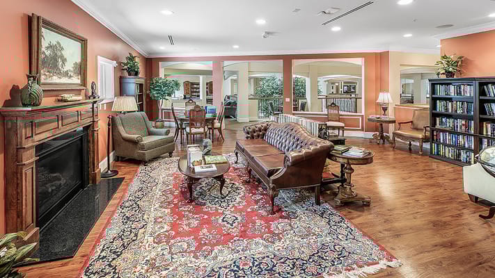 Bright common area with seating and bookshelves