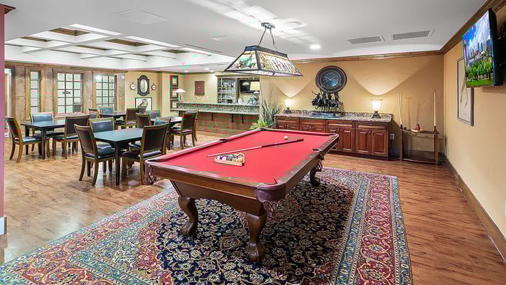 Interior common area with pool table and dining setup