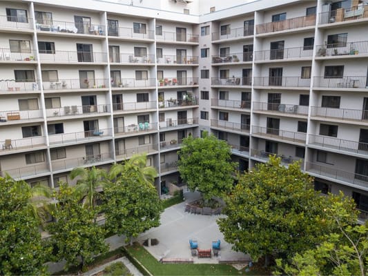View of the courtyard with greenery and balconies at Pasadena Highlands