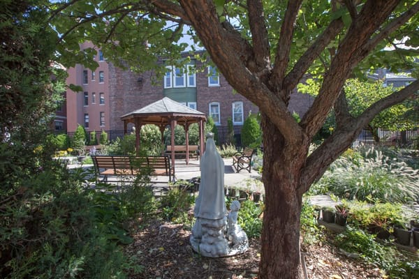 Serene garden area with gazebo and statue